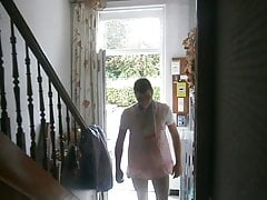 Small stroll in front of the house dressed in baby with its