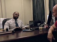 Black doctor taking something out of a white guys ass