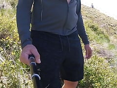 Naked hike in the mountains while I take my clothes off one piece at a time.