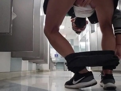 Milking off and spunking with my trousers down to my ankles at the Chicago airport shower