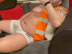 Sweaty builder jerks off and cums on couch in urine-soaked undies