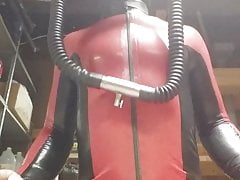 Latex catsuit and heavy rubber helmut