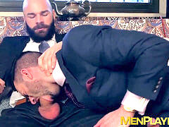 Handsome businessman enjoys a steamy blowjob in his suit from a muscular hunk