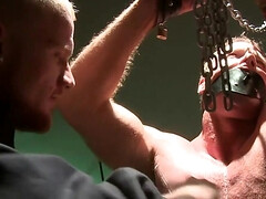 Two men with great bodies are tormenting a muscular lad