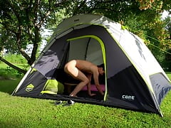 Brave teen pissing and cumming while campers drive by his tent