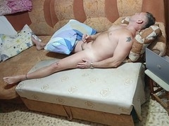 My hubby strips on the couch and strokes his cock.