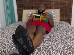Black jock Dallas displays off his size 12 soles in filthy socks
