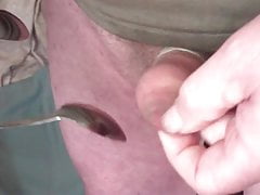 Foreskin with a table tennis ball, scissors, two spoons