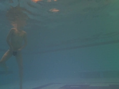 Taut booty finds faux-cock underwater and swims with it