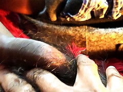 Stroking my very hairy uncut bush!