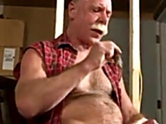 Scott Reynolds smokes a cigar while playing with his cock