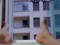 Trying to be caught full naked at window by neighborhood