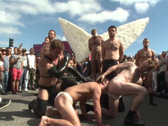 Submissive man lets his masters take advantage of him in public