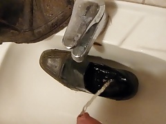 Piss in men's dress shoe