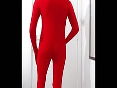 Having fun at home wearing a red zentai suit. I love it !