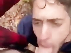Friend blows his buddy after class in the woods