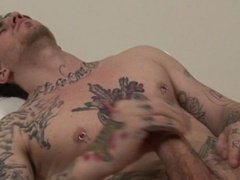 Dark-haired tattooed stud Rick Nolan jacking off