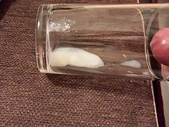 Slow motion Cumshot to glass cup