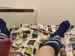 Stroking in football socks