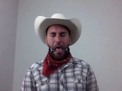 Scruffy guy in wild west setting selfgags with bit gag for gay bondage fun