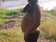 Bear Masturbating on the river bank