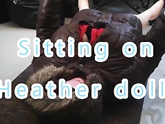 Sitting on big boob sex doll.
