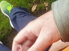 Jerking off and cumming in the open air in a park