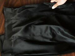 Secretary Jackie's black Bebe slit satin pencil skirt
