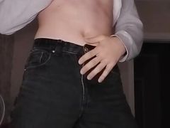 A young student in a mask plays with his dick through his panties