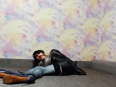 A crossdresser roped in an armbinder and ball-gagged, incapable to unwind the bonds