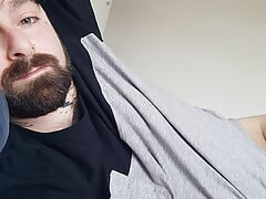 Naked bear in bed masturbates his big cock