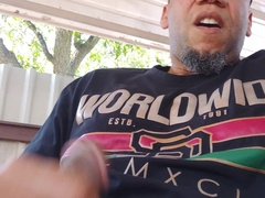 Fapping off in the backyard. Spunking on the table