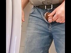 Fat smoking man pisses into toilet