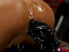 Lubed up Wrex Wylde ass gaped and fisted in threesome