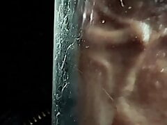 Penis pump sucks precum from veiny cock close up