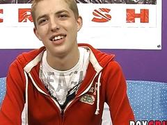 Smiling young homo jerks off and shoots his load out