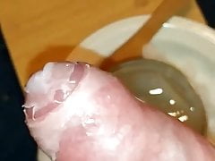 Dipping cock into hot wax