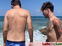 Brazilian guys show off queer pride during outdoor beach celebration