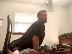 Tightly toned ass gets played with a hefty dildo