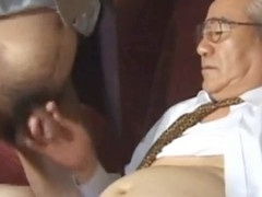 Asian mature man in elegant suit indulges in steamy gay activities