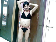 Hot sissy crossdresser femboy Sweet Lollipop in a hot red and black lingerie.