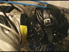 Hogtied bikerslave is suspended