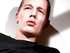 Dashing stud relaxes while smoking and stroking his dick solo