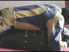 the slave in sleepsack with master in bikersuit