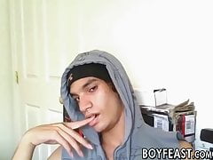 Dashing twink strips on camera and strokes his massive cock