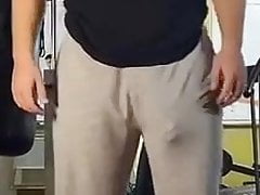 Guy at gym lifting weights huge bulge in grey trackies
