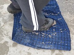 wet soil on blue tartan skirt