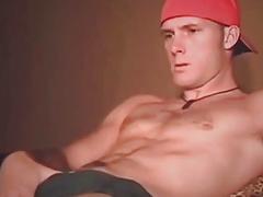 Frat boy lies back while his boner is jerked