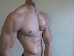 Muscular Men Showing Off Their Pecs