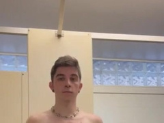 Lovely lad jerks off in a public douche with the door open